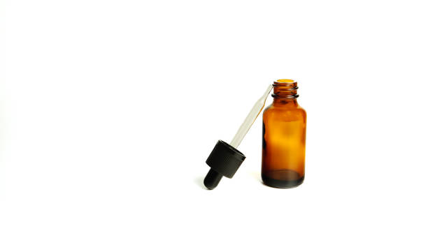 istock Brown glass bottles.A bottle with a pipette, isolated on a white background. glass container for cosmetic skin care products. Aromatherapy, essence, or perfume is empty. a bottle of cosmetic dropper. Amber apothecary flask with pipette. Beauty collagen pi 1313063076