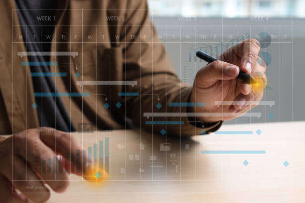 istock Businessman working project and update Gantt Software Chart scheduling virtual diagram and progress planning quality and communication gantt on virtual screen 1313064873