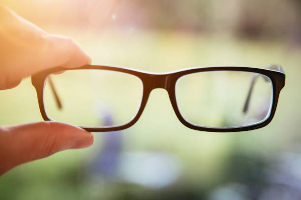 istock Sense concept: holding black glasses outdoors 1313067862