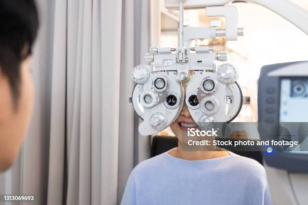 Scripted Optometry Selective Focus At Optometry Frame Equipment While Doctor Using ...
