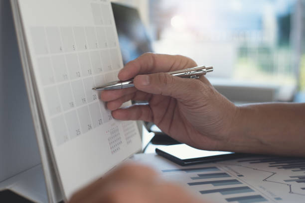 istock Man planning schedule calendar and reminder agenda, working in office 1313069812
