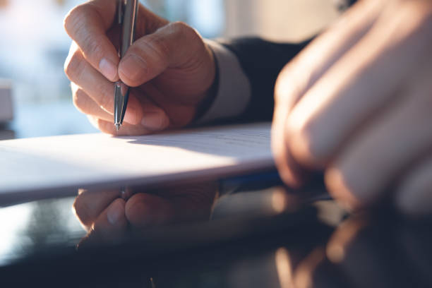 istock Businessman working in modern office, signing contract 1313070567