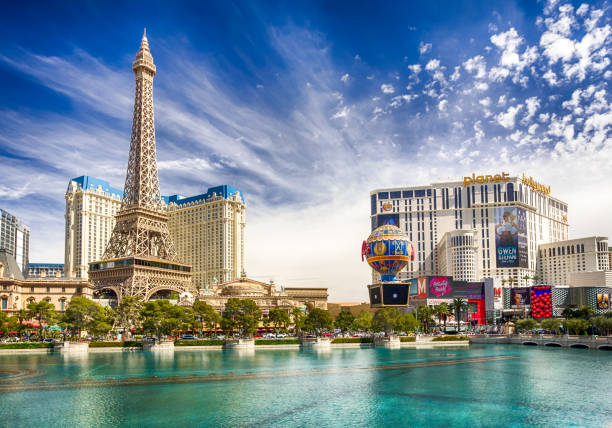 Las Vegas The Strip viewing from Bellagio Las Vegas, Nevada - March 27th, 2019 Eiffel Tower and Paris hotel and casino on The Strip viewing from Bellagio side las vegas stock pictures, royalty-free photos & images