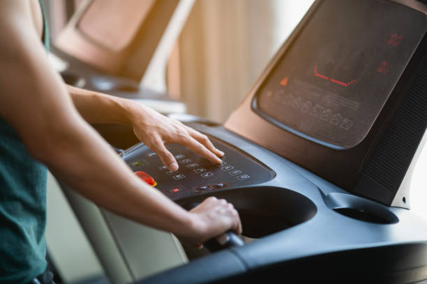 istock sport man running on treadmill at the gym 1313074764