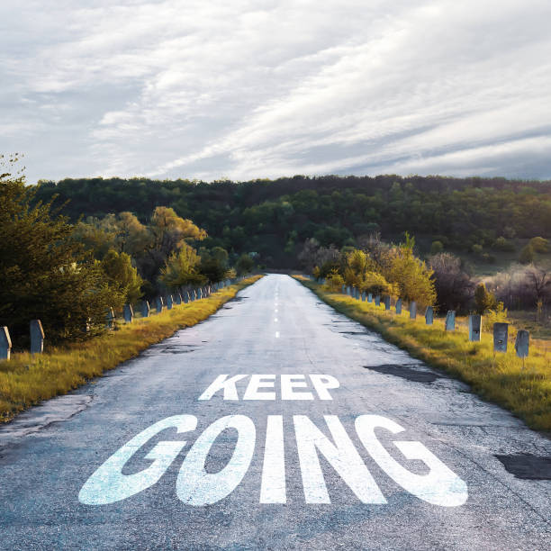 istock Keep going. Words on the road. Motivation concept. 1313075922