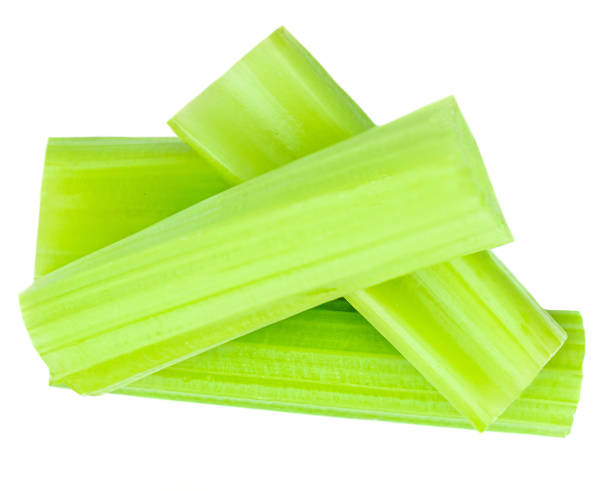 istock Fresh Celery isolated on white background. Cutted Celery sticks. Top view