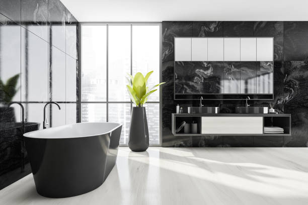 istock Bathroom interior. Minimalist bathtub on white floor with plant and sinks 1313081047