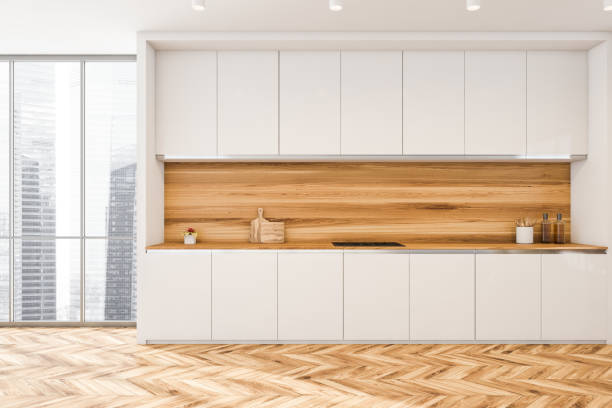 istock White wooden kitchen set near window, parquet floor 1313081056