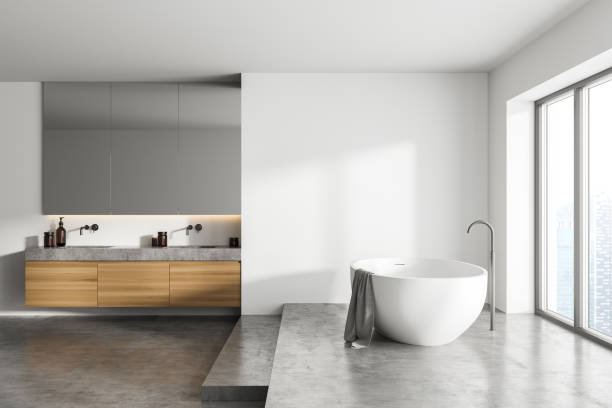 istock White bathroom interior and sinks with mirror and window 1313081723