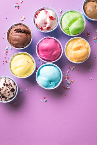 Ice Cream Assortment Ice Cream Assortment. Various ice creams or gelato on purple background, copy space. Frozen yogurt  in small cups - healthy summer dessert. frozen yoghurt stock pictures, royalty-free photos & images