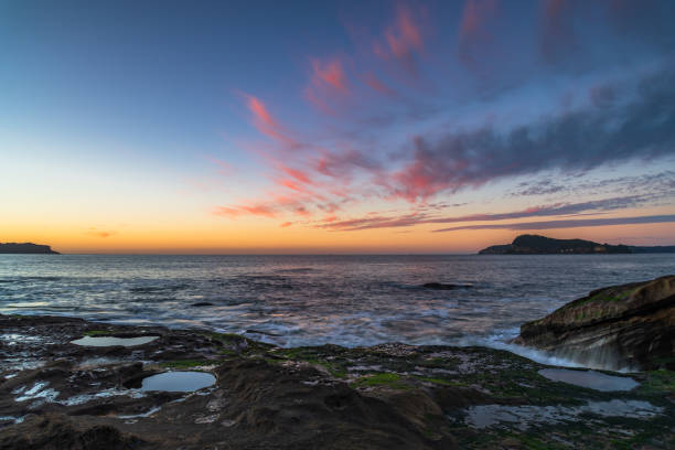 istock Sunrise seascape with scattered high cloud 1313081912