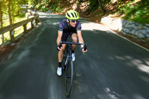 istock Bicycle rider going down a mountain road 1313082035