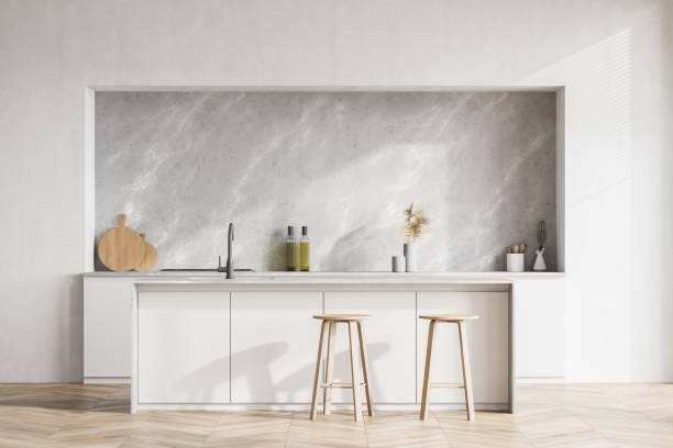 istock Modern contemporary design kitchen room interior. Dining island table with two stools. White and wood material. 1313083307
