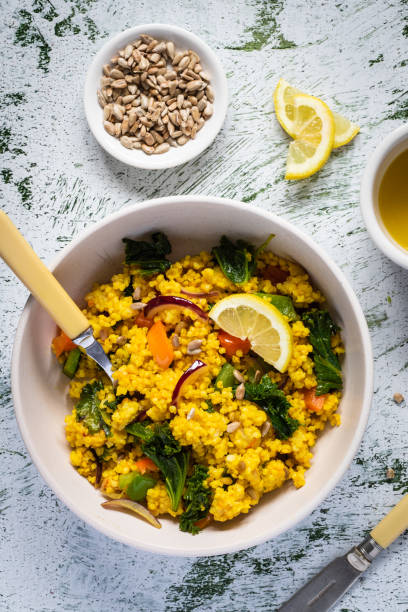 istock Millet with sunflower seeds, lemon dressing and kale. Top view. 1313085942