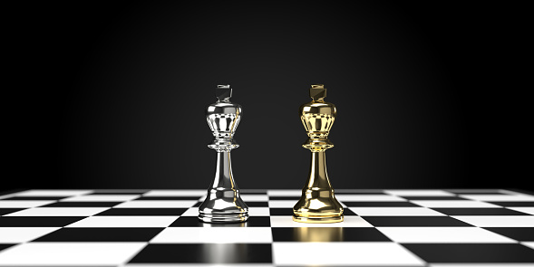 Business strategy, planning and success concepts; gold and silver 2  king standing on chess board with large copy space.