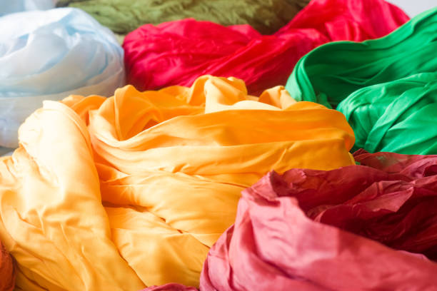 istock Bright silk scarves, yellow, blue, red, green. 1313088835