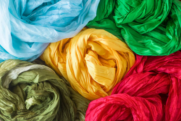 istock Bright silk scarves, yellow, blue, red, green. 1313088840