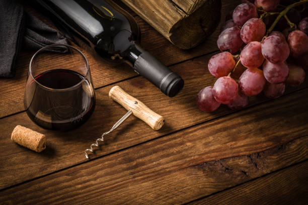 istock Wine bottle with grapes and a drinking glass 1313091100
