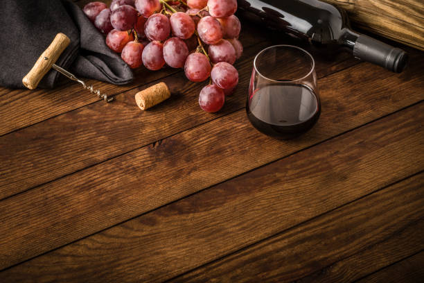 istock Wine bottle with copy space on a wooden table 1313091125