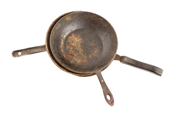 istock old disgusting stained rusty cast iron pan stack with burnt fat and food leftovers isolated 1313091356