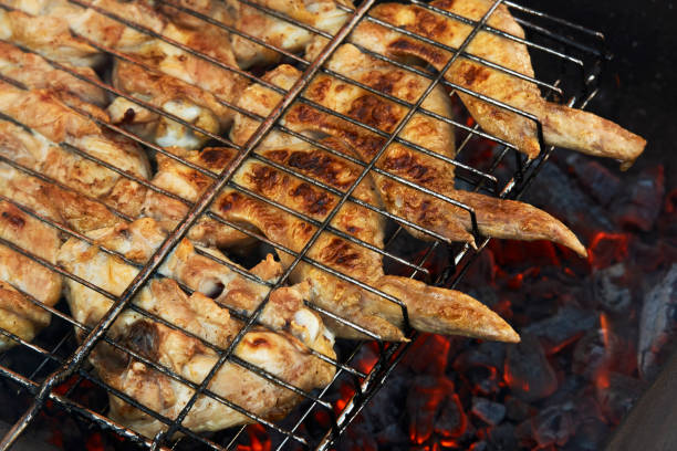 istock Chicken wings on grill, close-up. Cooking bbq chicken 1313092504