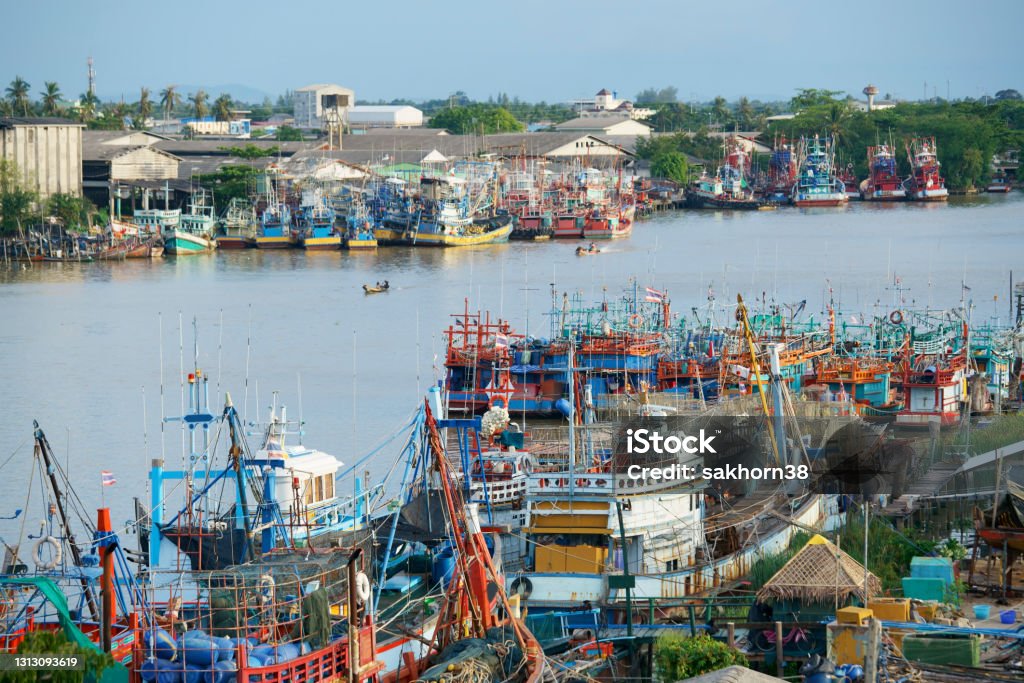 Riverscape of pattani Riverscape of pattani with port of tradition fish ship along the river,capital business is fishering industry in  pattani province, THAILAND Thailand Stock Photo