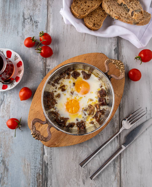 istock Turkish scrambled eggs with roasted meat in copper pan 1313094718