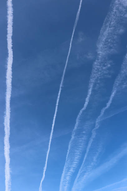 istock Traces of planes and clouds. Blue sky with plane trails. 1313098992