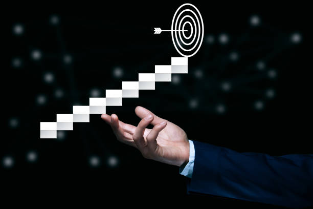 istock business man holding target icon 1313102412