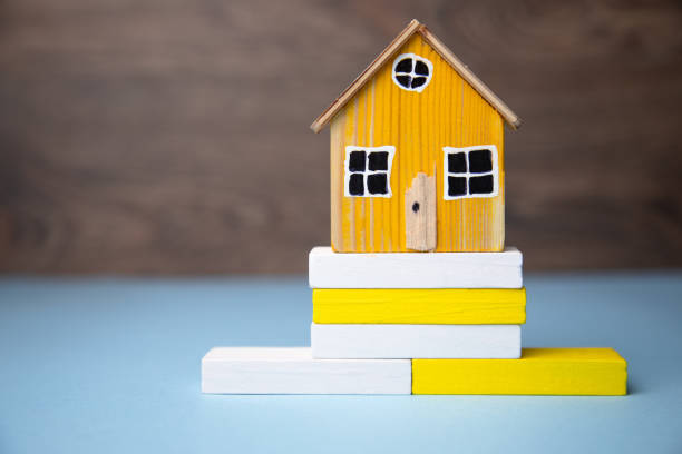 istock house model on wooden blocks 1313102430