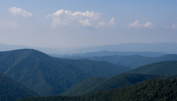 istock Summer day in the mountains under a bottomless sky with clouds 1313107082