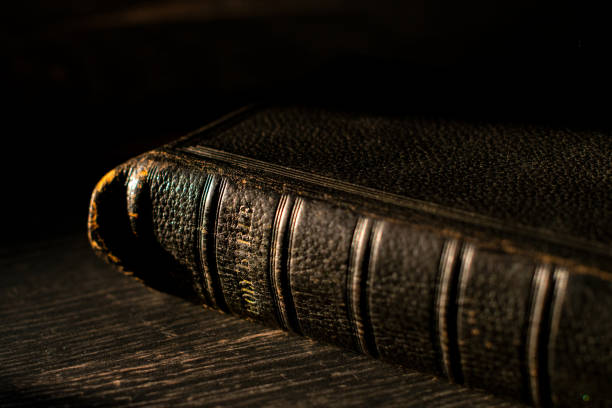 istock Old Bible on a wood table 1313108053