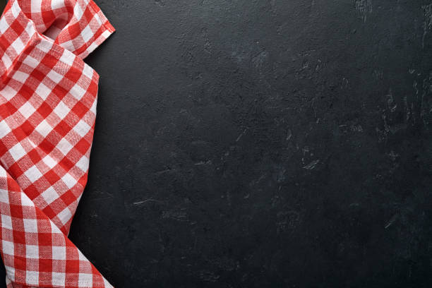istock Red tablecloth on kitchen table black color with for your recipe or menu. Top view flat lay. Mock up. 1313109117