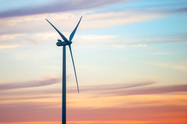 istock Windmills for electric power production at sunset 1313109219
