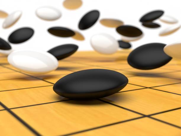 istock The moving stone fall onto the board Goban - 3D Render 1313111267
