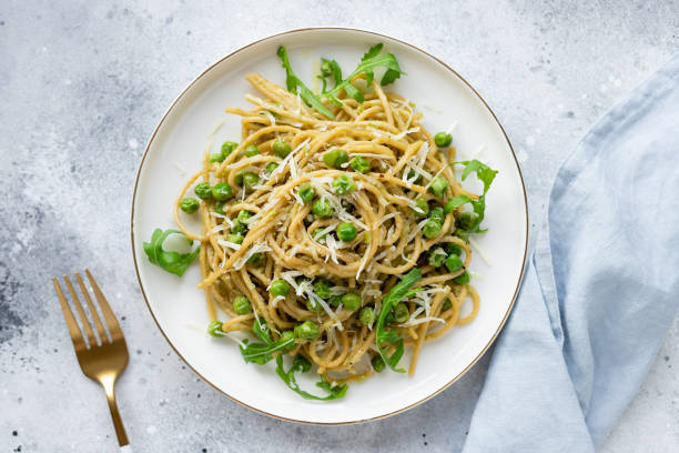 istock Vegan lunch plate. pasta spaghetti with green peas 1313112702