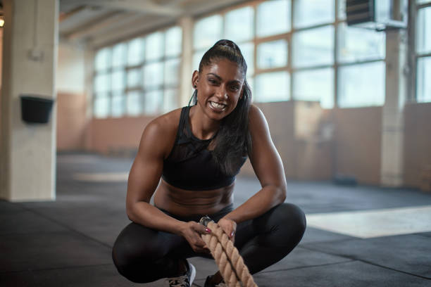 istock Fit woman smiling after a rope workout 1313113197
