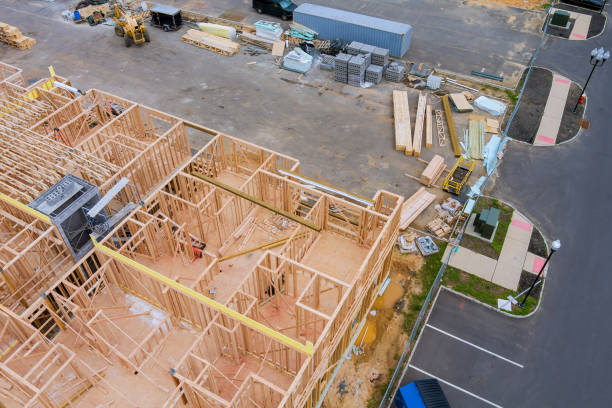 istock Stacked wooden building materials stack a new development framing of new house under construction 1313115722