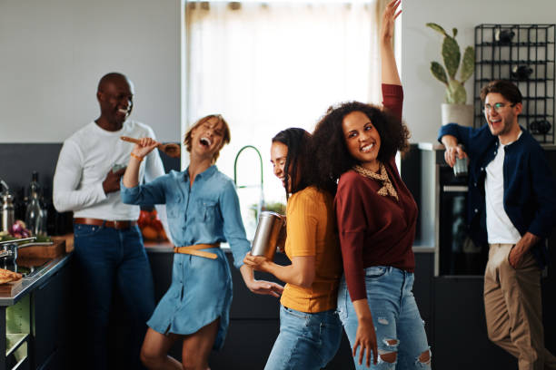 istock Carefree friends hanging out in a kitchen 1313116347