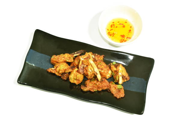 istock spicy deep fried squid Thai pancake dipping with sweet sauce 1313116914