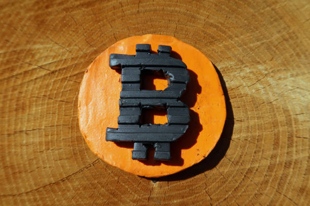 istock Bitcoin symbol on a tree stump. Metaphor for 'money grows on trees' 1313117588