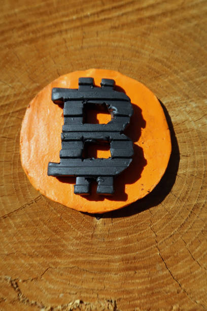 istock Bitcoin symbol on a tree stump. Metaphor for 'money grows on trees' 1313117601