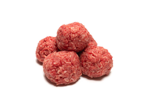 istock Raw meat balls isolated on white background. 1313118967