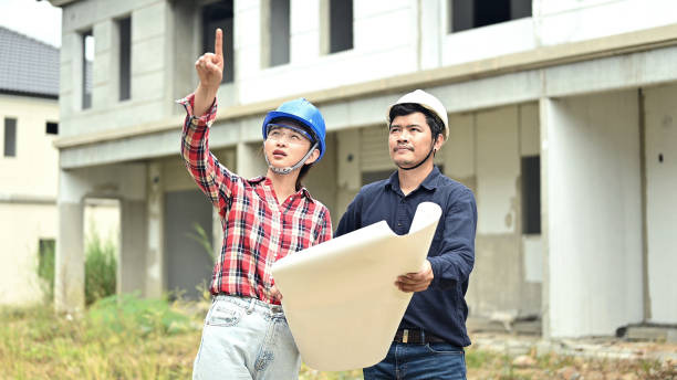 istock Engineer team discuss and working at construction property site. Inspection at village project and estate building. 1313120446