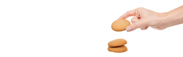 istock Hand with home made cookie isolated on white background. 1313120779