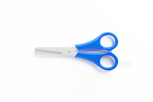 Multipurpose scissors with orange handle is isolated on white background with clipping path.
