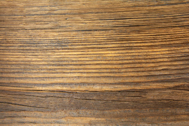istock Old dilapidated pine wooden board on the wall. 1313126050