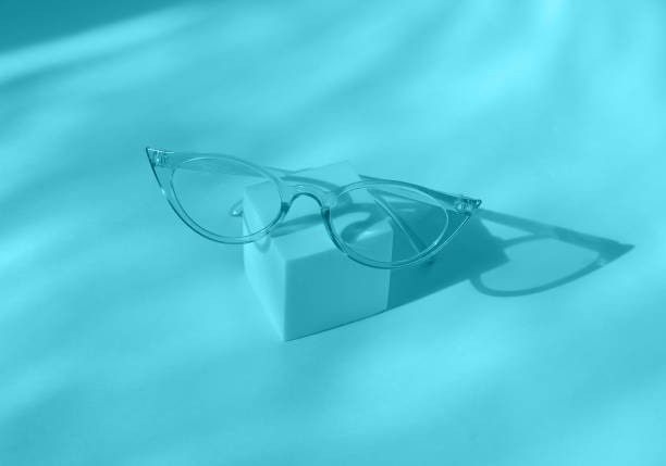 istock Sunglasses on square podium in trendy color background. 1313126225