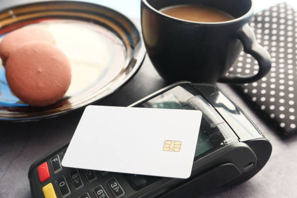 istock contactless payment concept with young man paying with credit card 1313126483