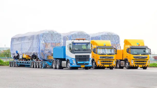 Photo of Oversize cargo trailer New diesel-electric locomotive on a multi-axle hydraulic modular truck trailer